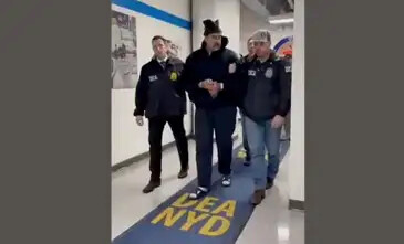 A still image from video posted by the White House's Rapid Response 47 account on X.com, which originated from the @PaulDMauro account, shows Venezuela's President Nicolas Maduro being walked in custody down a hallway at the offices of the U.S. Drug Enforcement Administration (DEA) in New York City, U.S., January 3, 2026. @RapidResponse47/Handout via REUTERS THIS IMAGE HAS BEEN SUPPLIED BY A THIRD PARTY. MANDATORY CREDIT.NO RESALES. NO ARCHIVES. THIS PICTURE WAS PROCESSED BY REUTERS TO ENHANCE QUALITY. AN UNPROCESSED VERSION HAS BEEN PROVIDED SEPARATELY.      TPX IMAGES OF THE DAYVerification- Reuters was able to confirm footage of Nicolas Maduro walking through the halls of DEA headquarters in New York as seen on corroborating footage showing same personnels ushering Maduro and DEA NYD crest on the wall.
- Logo on wall matched DEA NYD from file images.
- Reuters witness footage showing convoy arriving at DEA headquarters in Manhattan.